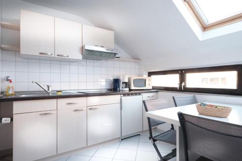 A cozinha ou kitchenette de Apartmenthaus Alt Graz