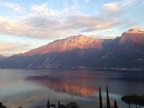 a view of a large body of water with mountains at Village Bazzanega - Montagnoli Group in Tremosine Sul Garda