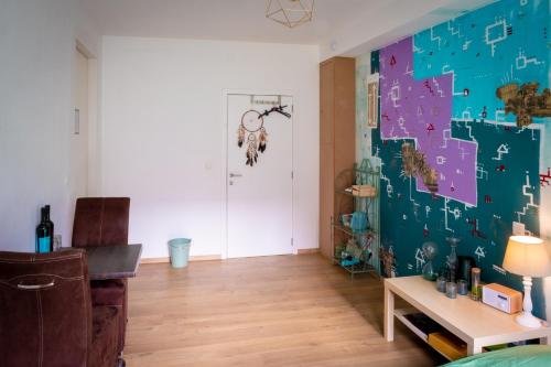 a room with a wall with a puzzle wall at Quartier Leonard in Ghent