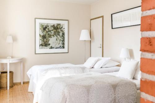 Ein Bett oder Betten in einem Zimmer der Unterkunft Lossiranta Lodge