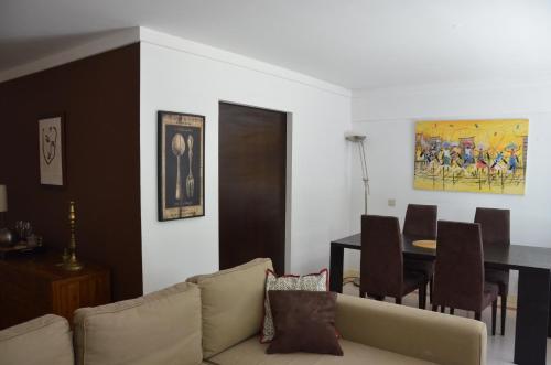 a living room with a couch and a table at Loft Lambert in Lisbon