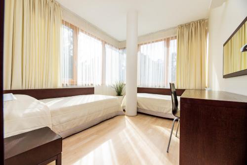 Ένα ή περισσότερα κρεβάτια σε δωμάτιο στο Apartamentai Tylios pušys