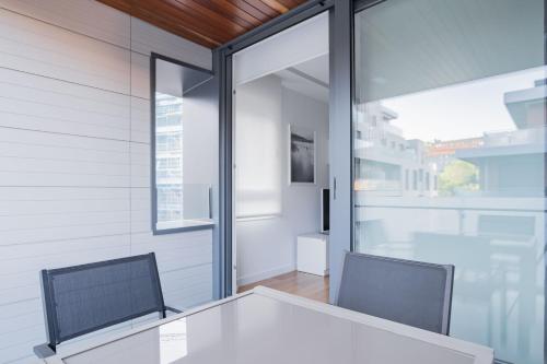 a dining room with a table and two chairs at GOXUE HOME in Donostia-San Sebastián