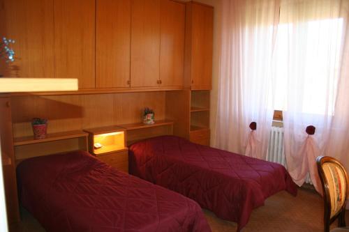 Posteľ alebo postele v izbe v ubytovaní La casa di Rachele