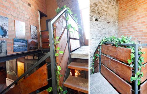 two photos of a staircase in a building with plants at La Calma de Bellver in Bellver de Cerdanya 