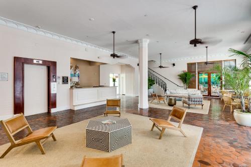 
a living room filled with furniture and a fire place at Clinton Hotel South Beach in Miami Beach
