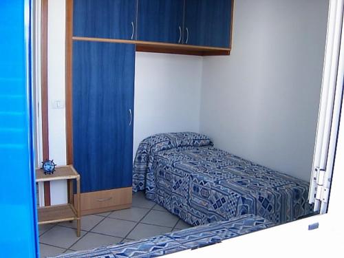 Postel nebo postele na pokoji v ubytování Appartamento Torre Pali