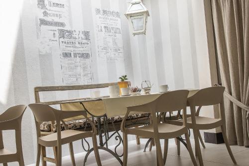 a dining room with a table and chairs at Hotel Torino in Parma