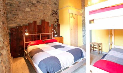 two pictures of a bedroom with a bed in a room at La Calma de Bellver in Bellver de Cerdanya 