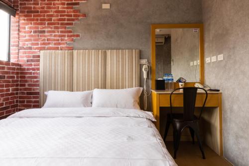 Postel nebo postele na pokoji v ubytování Longshan Inn