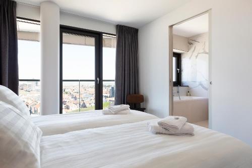 Ліжко або ліжка в номері Maris Apartments