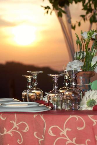 a table with several glass jars and plates on it at Agriturismo Le Piagge in Ponzone
