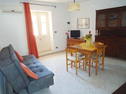 a living room with a couch and a table at casa nina in Mondello