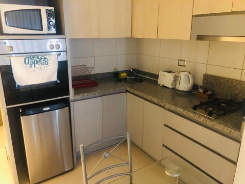 Η κουζίνα ή μικρή κουζίνα στο Apart hotel Fraga
