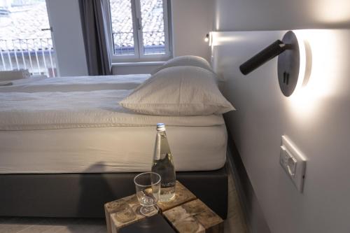 En eller flere senge i et værelse på Picalof Apartments