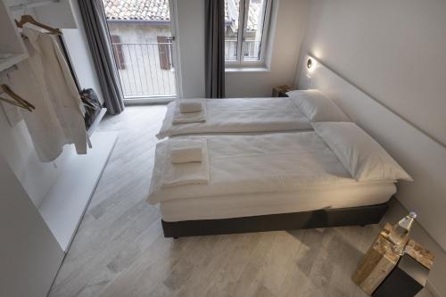 En eller flere senge i et værelse på Picalof Apartments
