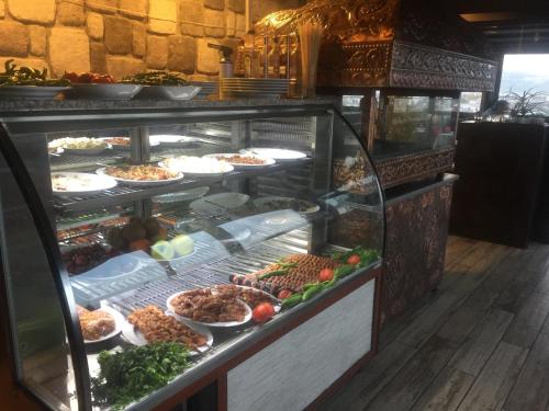 a display case with many different types of food at RİVADA HOTEL in Kartepe
