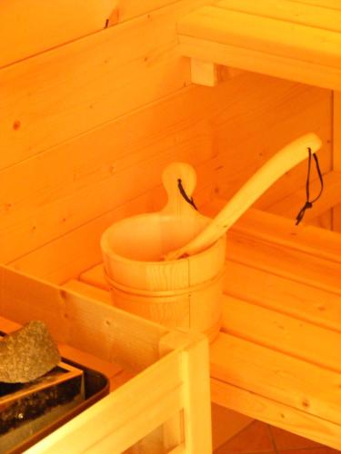 a wooden sauna with a hose coming out of it at Ai Casali in Cividale del Friuli