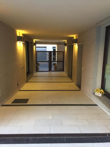 an empty hallway of a building with a gate at Sophie Home - Comfort e Relax a pochi km da Nora in Pula