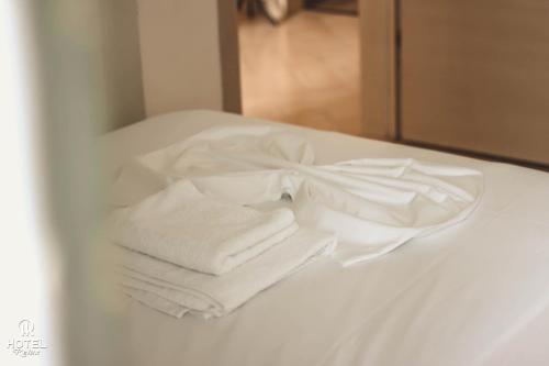 Кровать или кровати в номере Hotel Relax