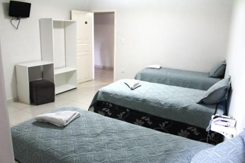 Voodi või voodid majutusasutuse Hotel Aracaju Express toas