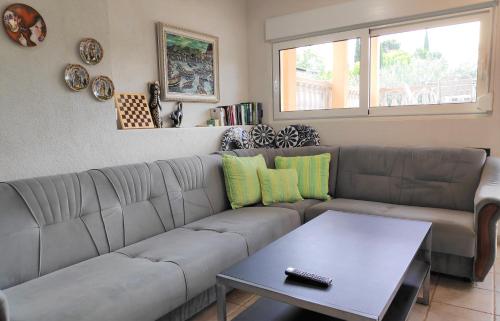a living room with a couch and a table at VILLA PUNTA BLAVA - beach front, ideal for kids, large terraces with sea view, internet, Netflix, no pets allowed, 3Kw EV ch in Obrovac
