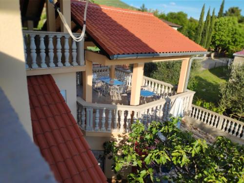 an aerial view of a house with a balcony at VILLA PUNTA BLAVA - beach front, ideal for kids, large terraces with sea view, internet, Netflix, no pets allowed, 3Kw EV ch in Obrovac