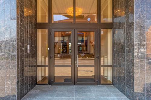 an entrance to a building with glass doors at Kesminta Šalčininkai in Šalčininkai