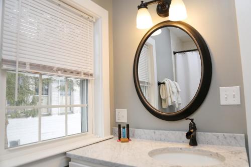 a bathroom with a sink and a mirror at Two Bedroom with Lake View in Wolfeboro
