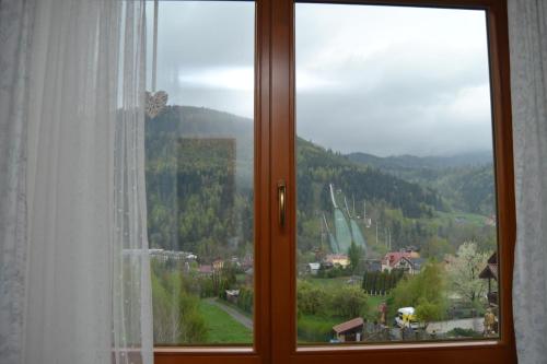 a window with a view of a mountain at Pokoje Gościnne u Joli in Szczyrk