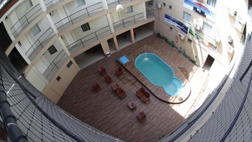 an overhead view of a building with a blue chair at Hotel Aracaju Express in Aracaju