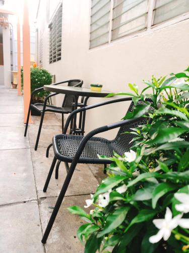 a group of tables and chairs on a patio at Chiangmun Boutique in Chiang Mai
