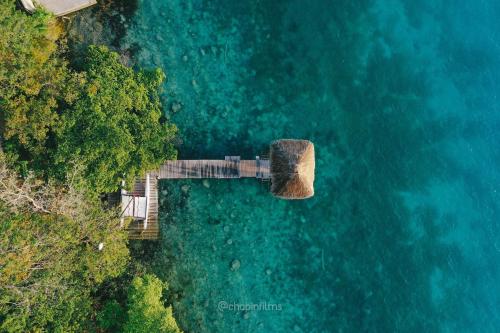 an aerial view of a wooden walkway over the water at BOA BOA Bacalar in Bacalar