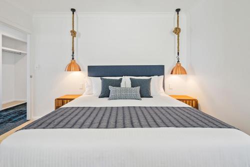 Ένα ή περισσότερα κρεβάτια σε δωμάτιο στο Freedom Shores Resort Airlie Beach