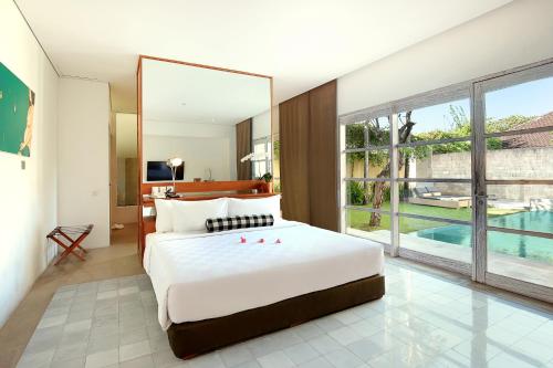 Ένα ή περισσότερα κρεβάτια σε δωμάτιο στο Uma Sapna