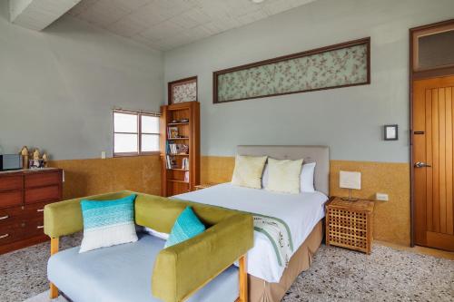 Ένα ή περισσότερα κρεβάτια σε δωμάτιο στο Bao Cheng Home