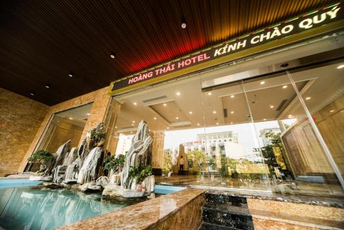 a store front of a shopping mall with chairs in it at Khách sạn Hoàng Thái in Sầm Sơn