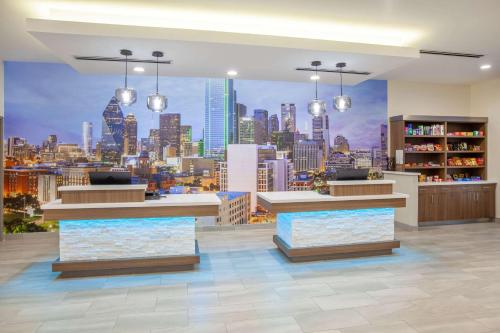 a store with a view of a city skyline at La Quinta by Wyndham Dallas Duncanville in Duncanville