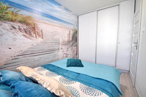 Una cama o camas en una habitación de Apartament Lazurowa Przystań Amber Sand w Kołobrzegu