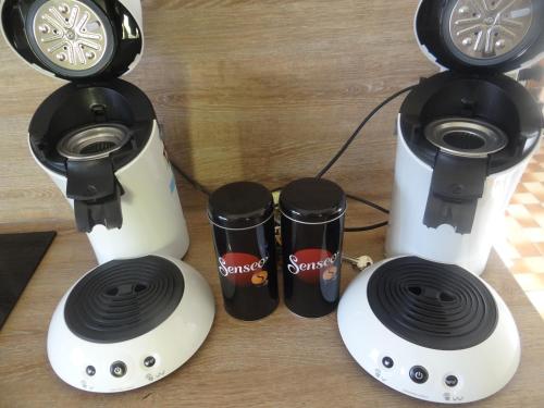 a group of three speakers sitting on a table at circuit expo zenith in Le Mans