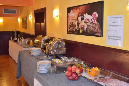 a buffet table with a variety of food on it at Hotel Palacky in Karlovy Vary