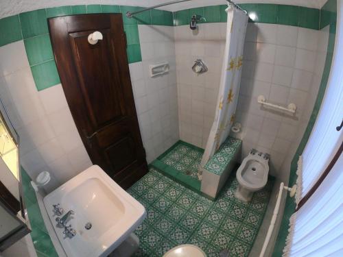 a small bathroom with a sink and a toilet at Ammiraglio - Villa Ziri in Giglio Porto