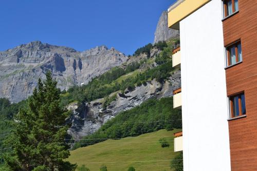 a view of the mountains from a building at Baron / Baronesse Apartments in Leukerbad