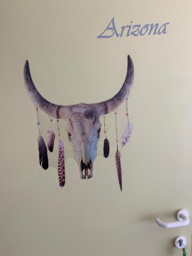 a skull of a bull moose hanging on a wall at Carpe Diem in Jumet