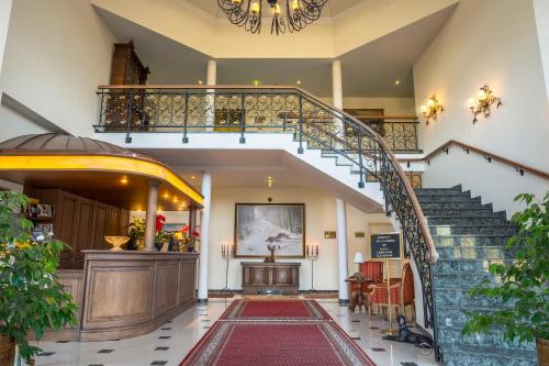 a staircase in a building with a stair case at Landhaus Lellichow in Lellichow