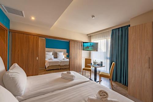Postel nebo postele na pokoji v ubytování Ddream Hotel