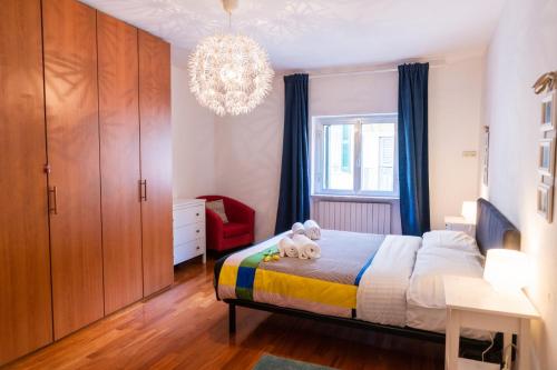 Postel nebo postele na pokoji v ubytování Domus Verona - Accogliente residenza Rocchetto a 25mt da Piazza Erbe