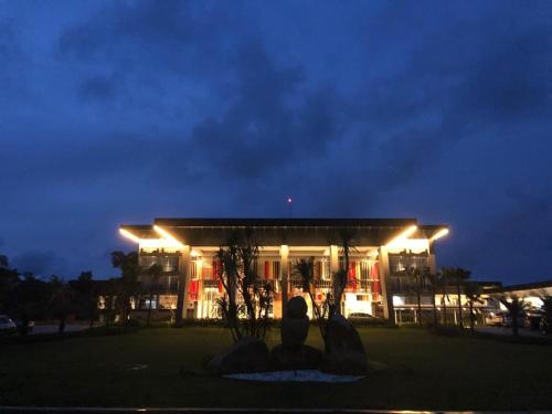 a building with lights in front of it at night at Swiss-Belresort Belitung in Tanjungbinga