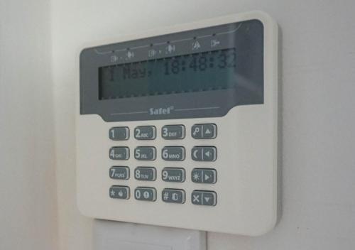 an electronic calculator is attached to a wall at Apartman Zagreb Maksimir in Zagreb