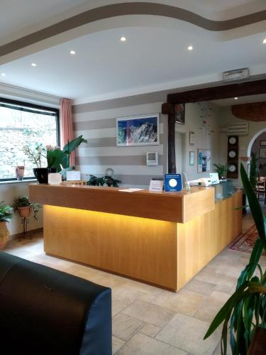 a lobby with a reception counter in a hospital at Albergo Ristorante Monterosa in Ameno